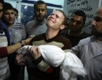 Photo: Jihad Misharawi, BBC Arabic Correspondent, carries his son’s body at a Gaza hospital. (AP) TAKE ACTION FOR GAZA: Stop the bombs, stop the siege, stop the blank check [November...