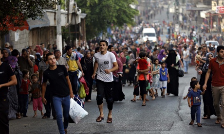 ‘Death and horror’ in Gaza as thousands flee Israeli bombardment